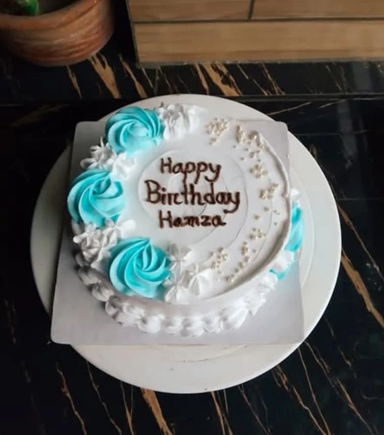 Birthday cake design made in Jashore by Made by Roshni — turquoise rosettes with a piped name