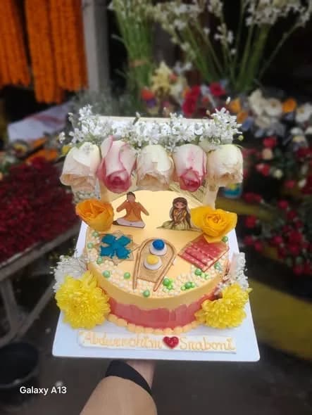 গায়ে হলুদ থিম কেক – ম্যারিগোল্ড ও কাপল ডল দুই স্তর 3